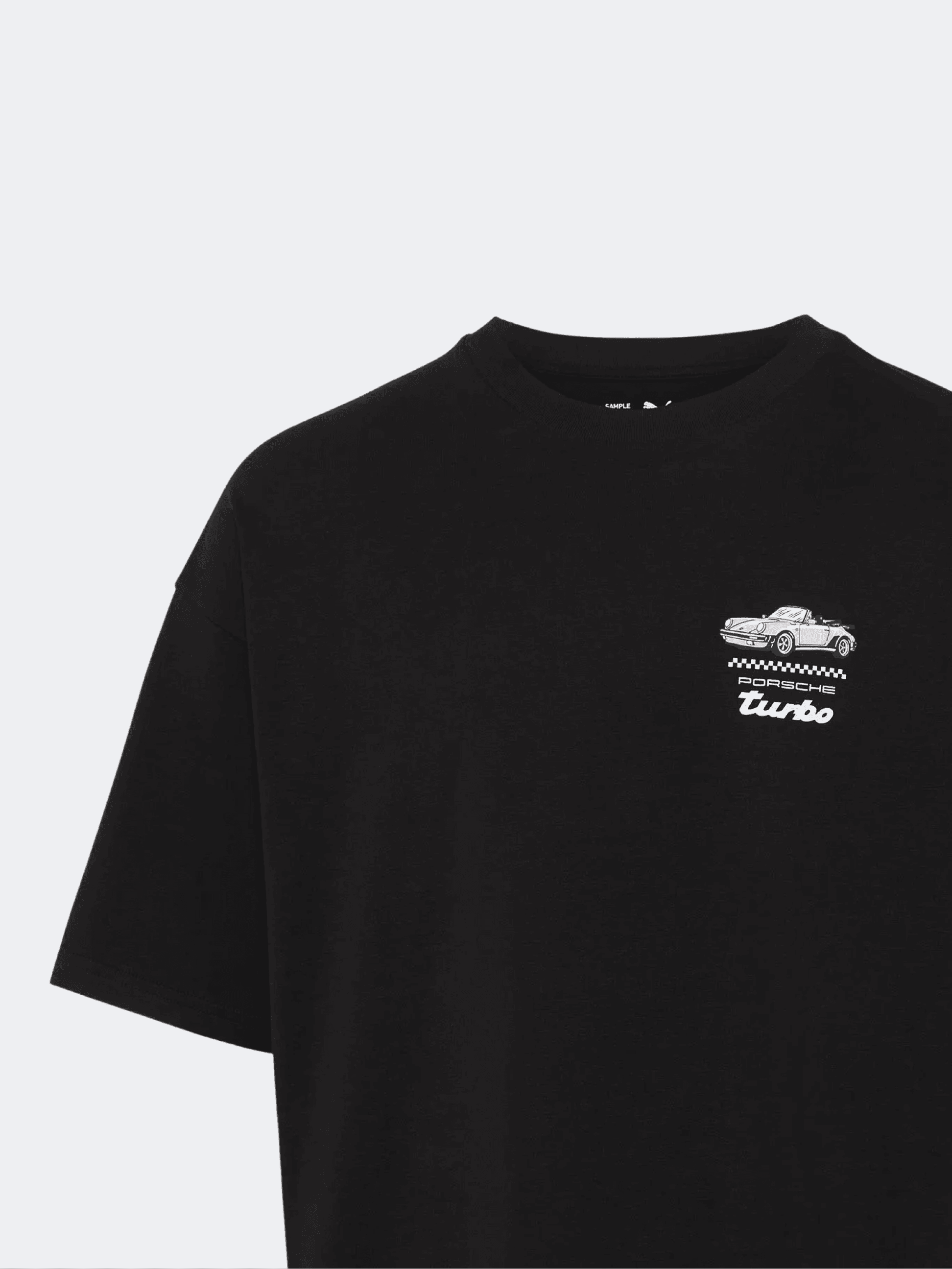 You can see a close up of a black Porsche shirt