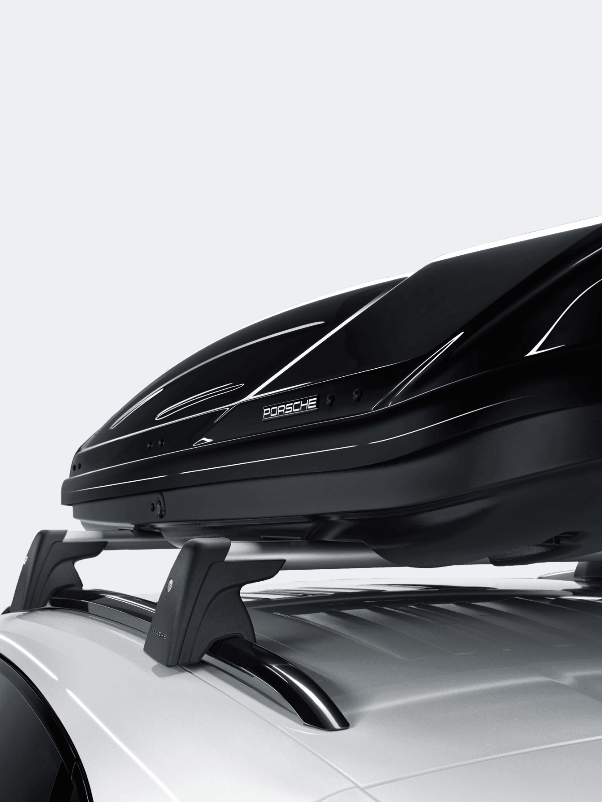 You can see a close up of a Porsche roof box on a car
