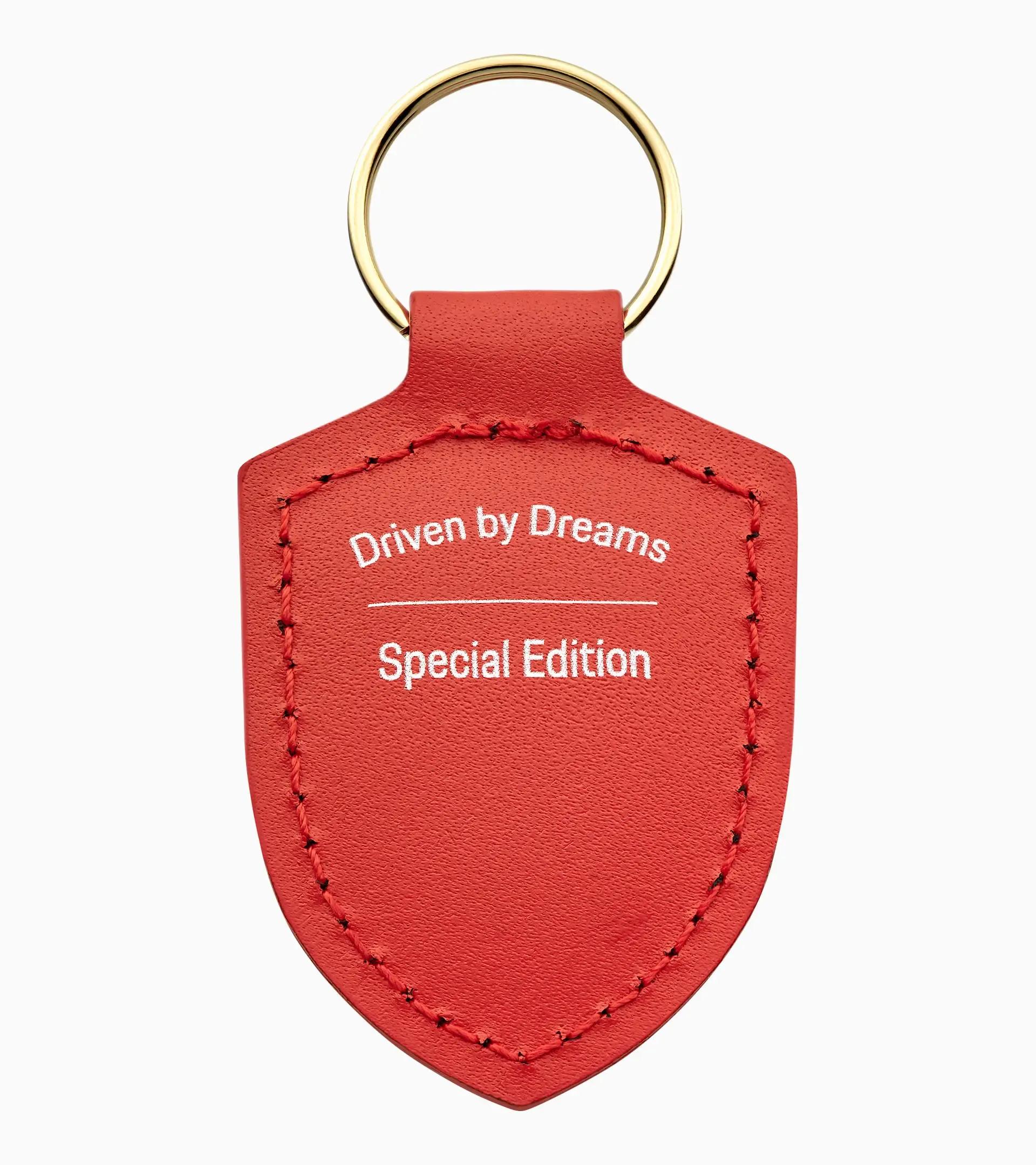 Porte-clés écusson « Driven by Dreams » – 75 ans thumbnail 1