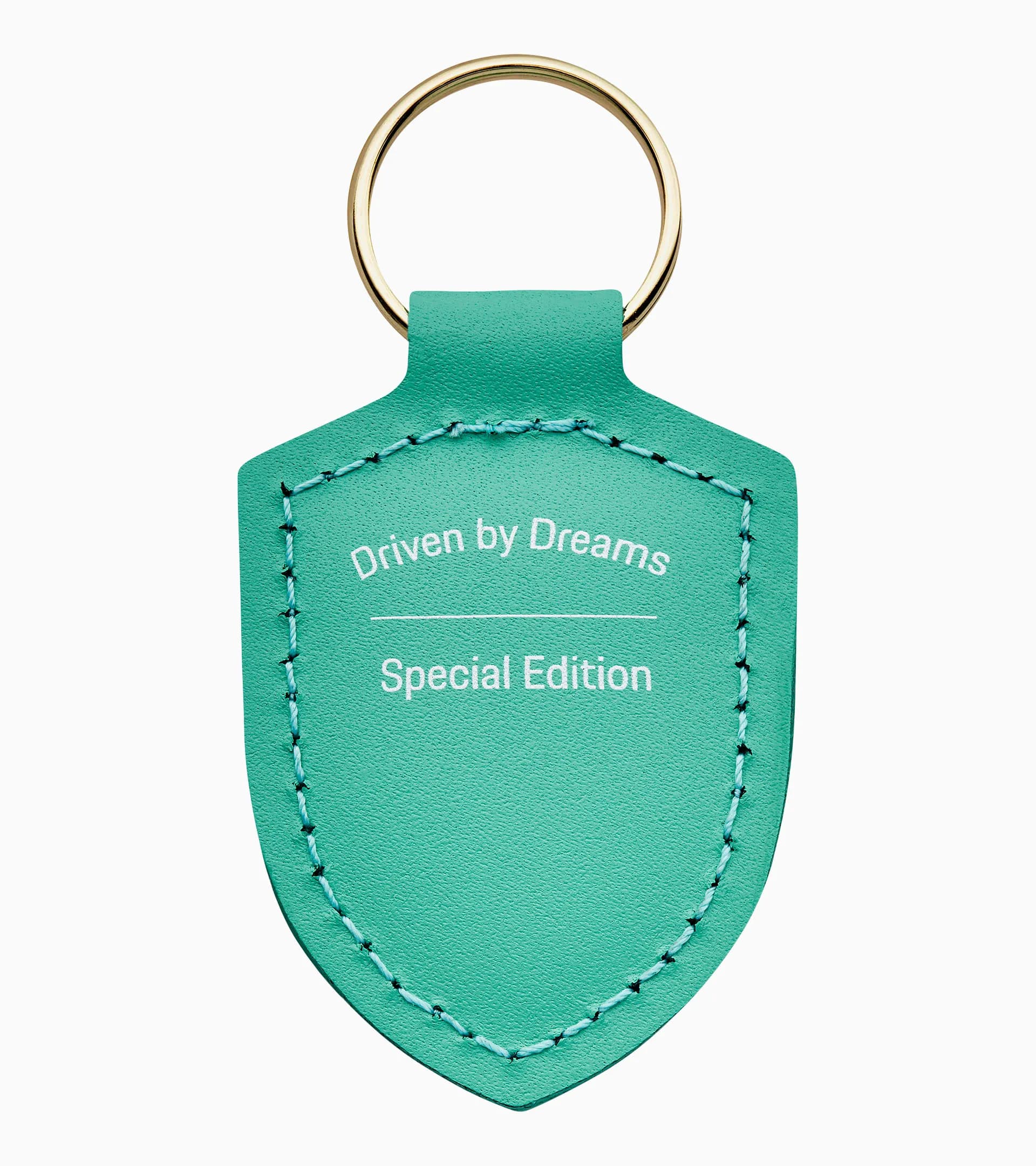 Porta-chaves com escudo "Driven by Dreams" – 75 anos 2