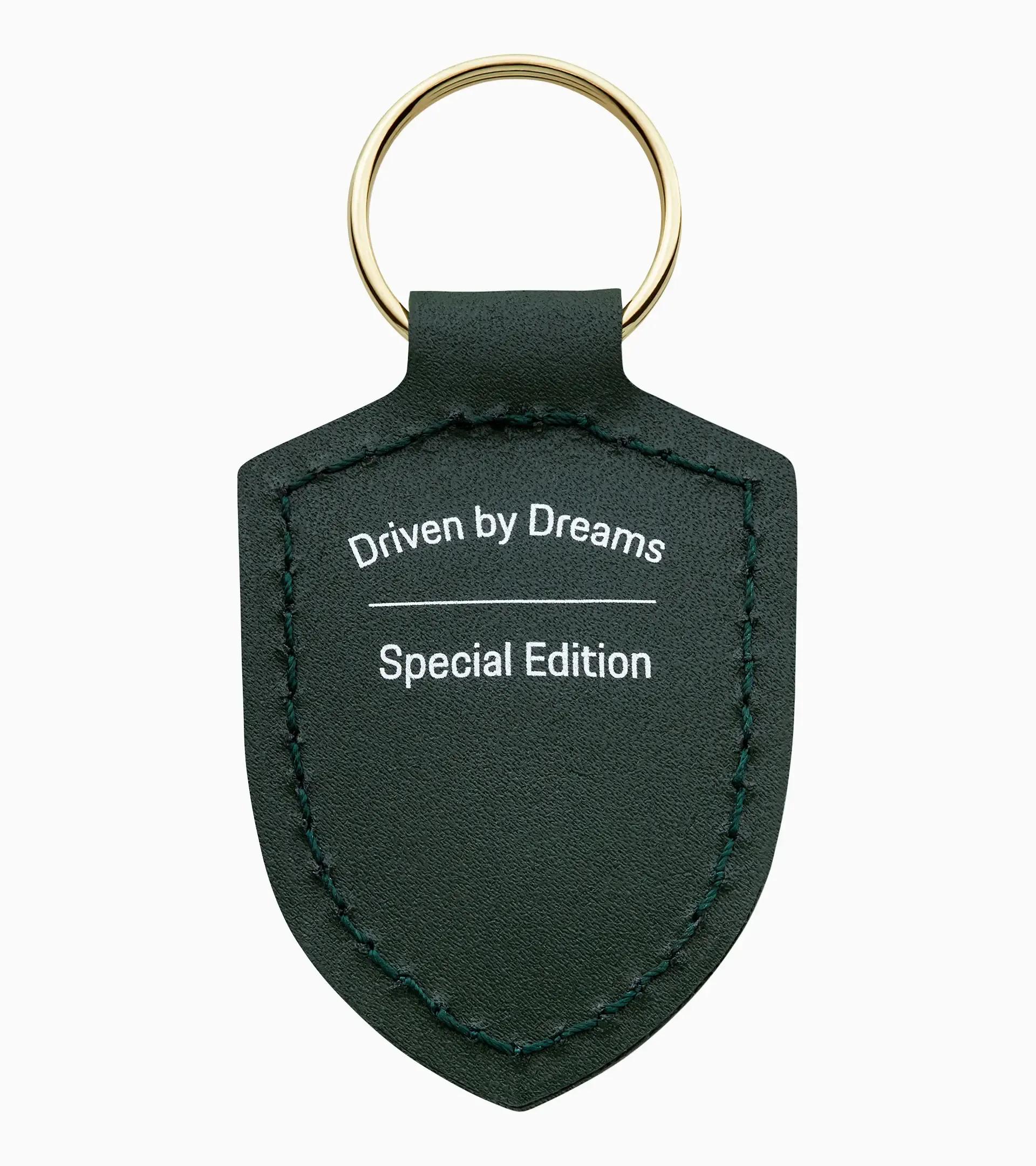 Porte-clés écusson « Driven by Dreams » – 75 ans thumbnail 1