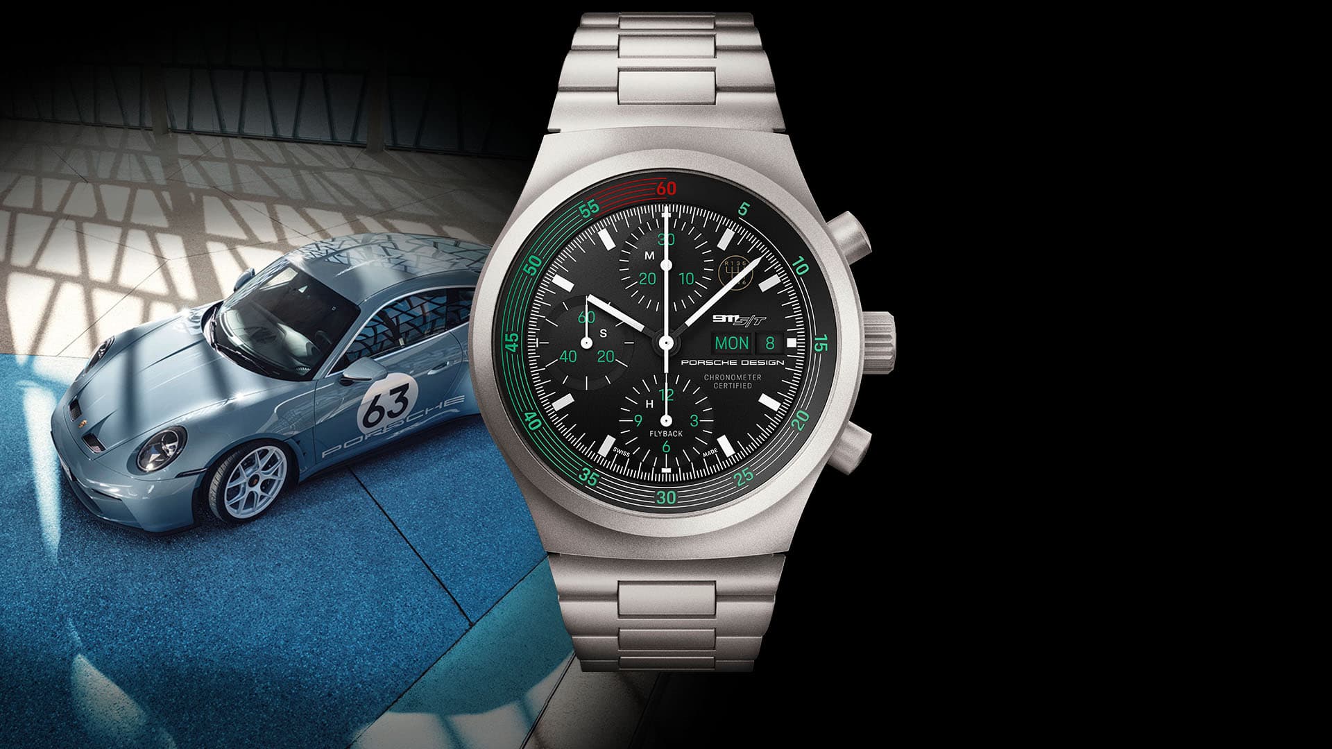 Srebrny zegarek chronograf Porsche Design z czarną tarczą; na pierwszym planie jasnoniebieskie Porsche 911 z numerem startowym 63.