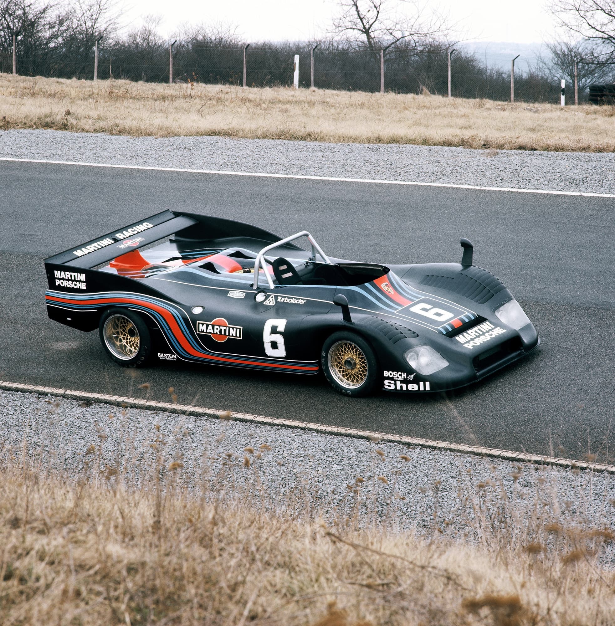 Historical image showing the Porsche 936 Spyder with starting number #6 on the race track