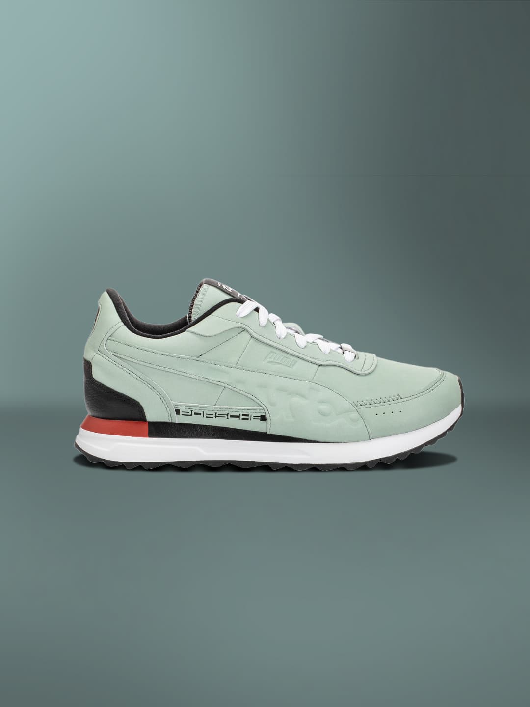 Light green colored sneaker on a light green background
