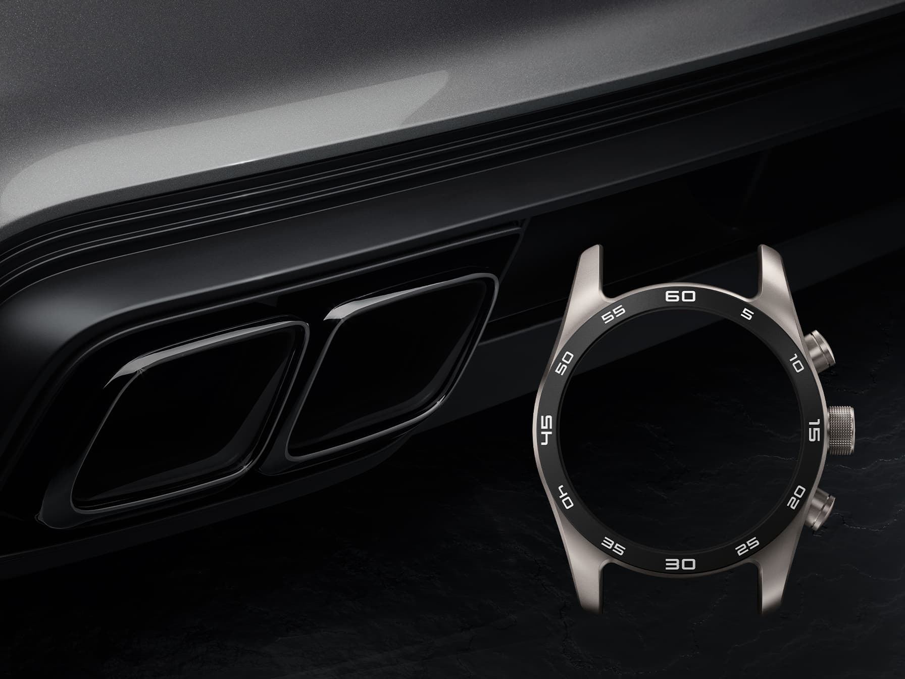 Titanium watch case with black minute bezel, shown beside a black Porsche rear grille in close-up