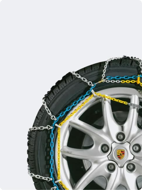 You can see a wheel with a snow chain on a white background