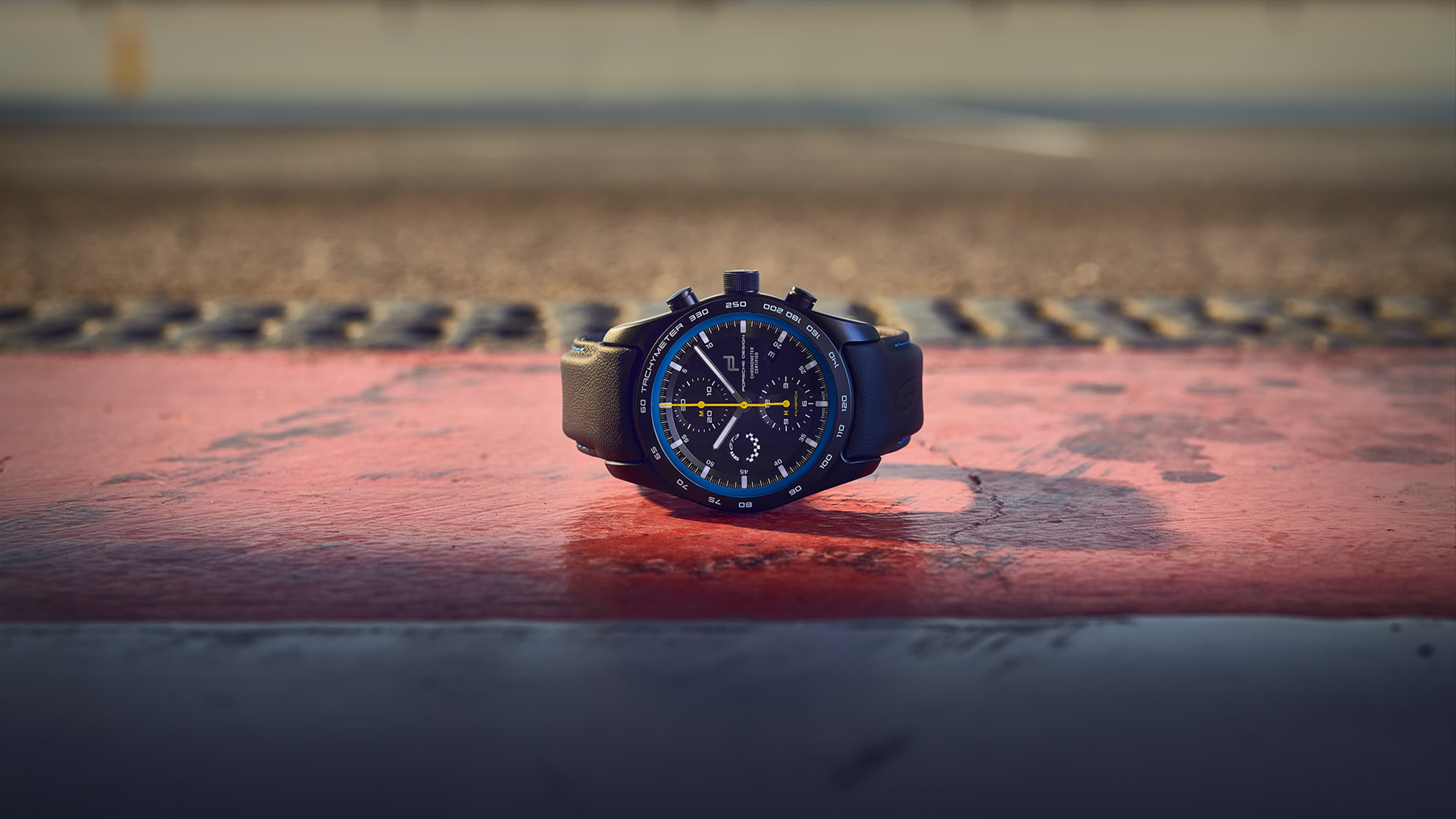 Pictured is the Chronograph 911 GT3 Porsche wristwatch, from the front on a road