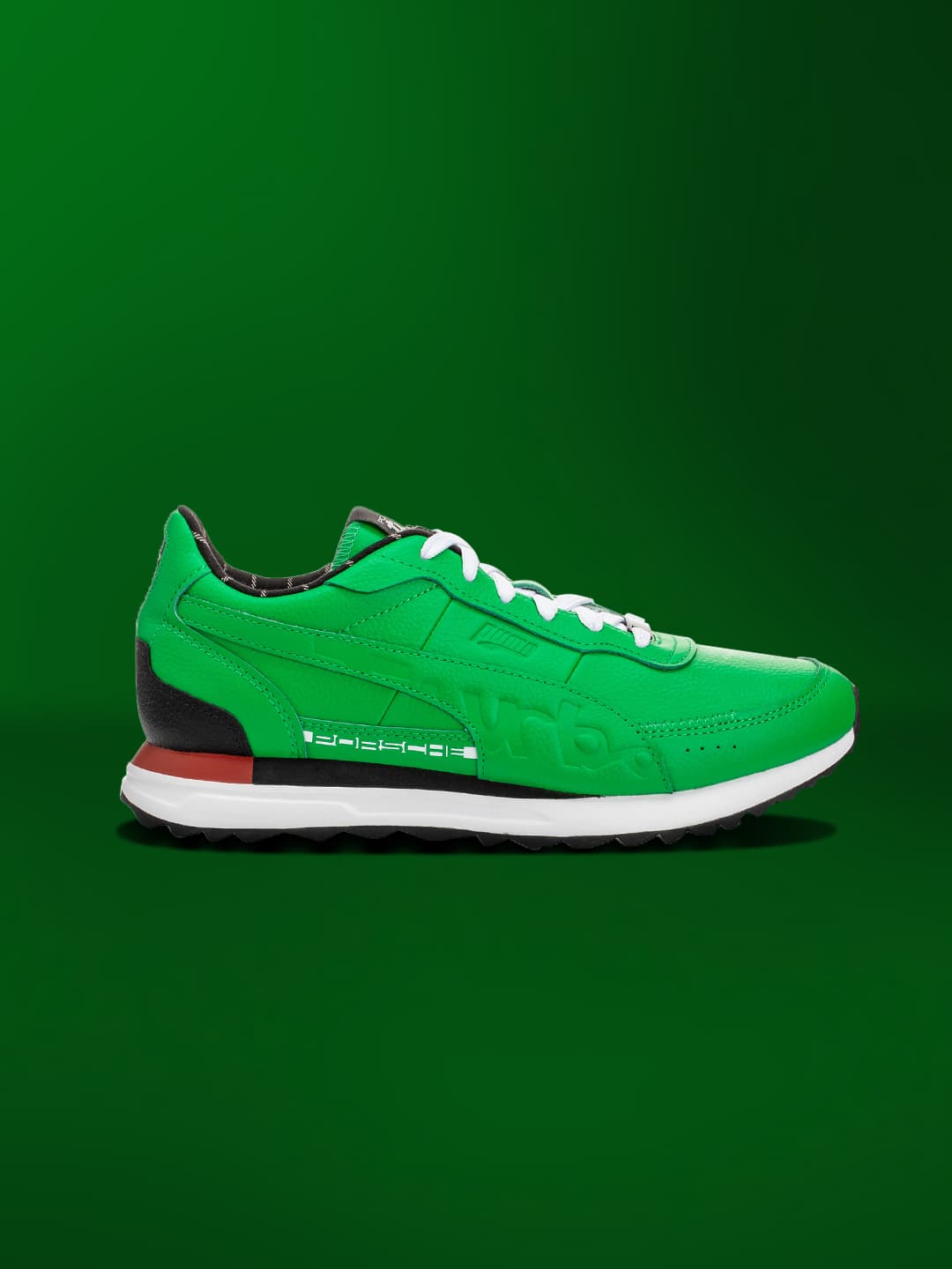 Green colored sneaker on a green background