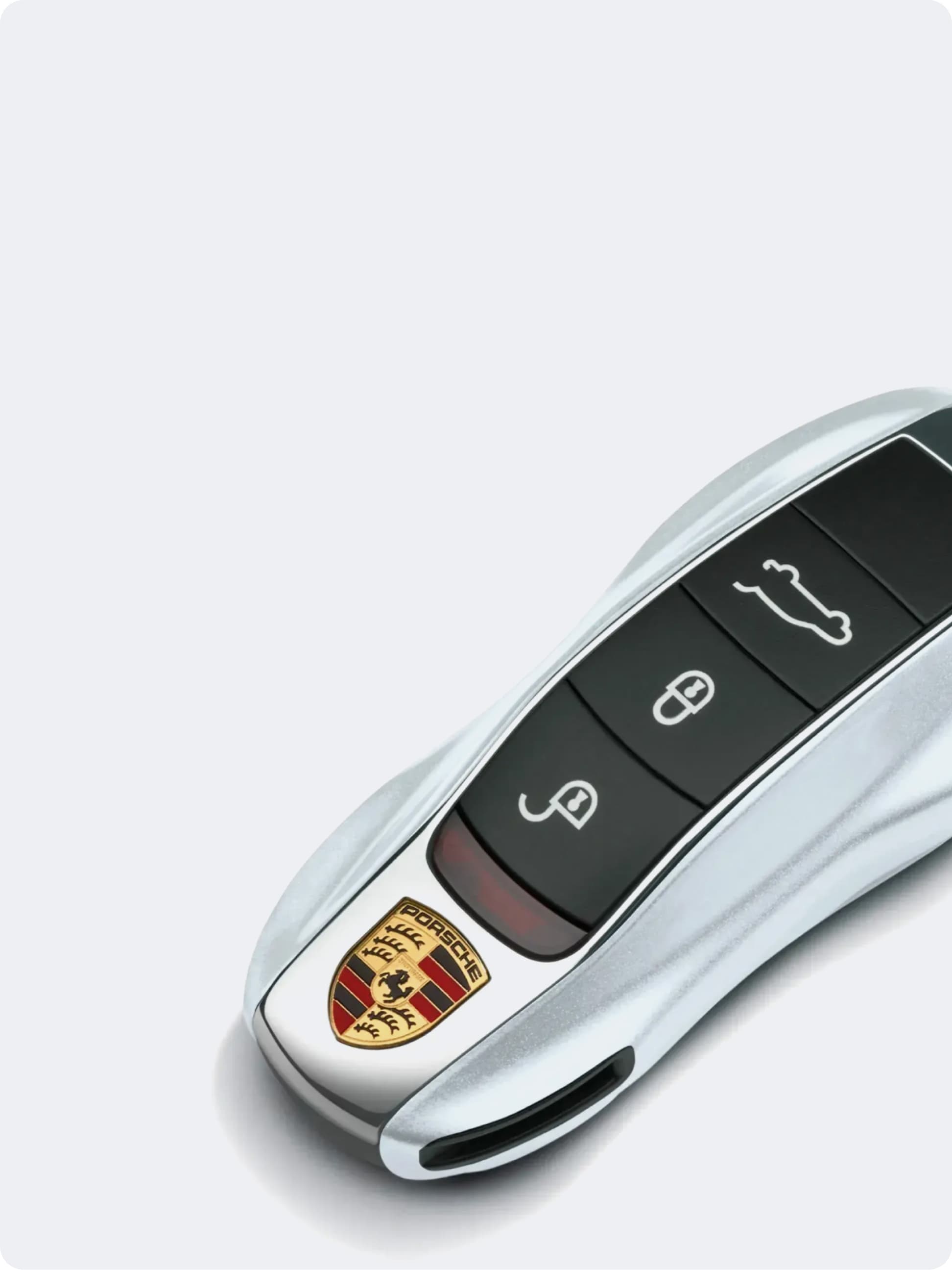 You can see a Porsche key ring on a white background
