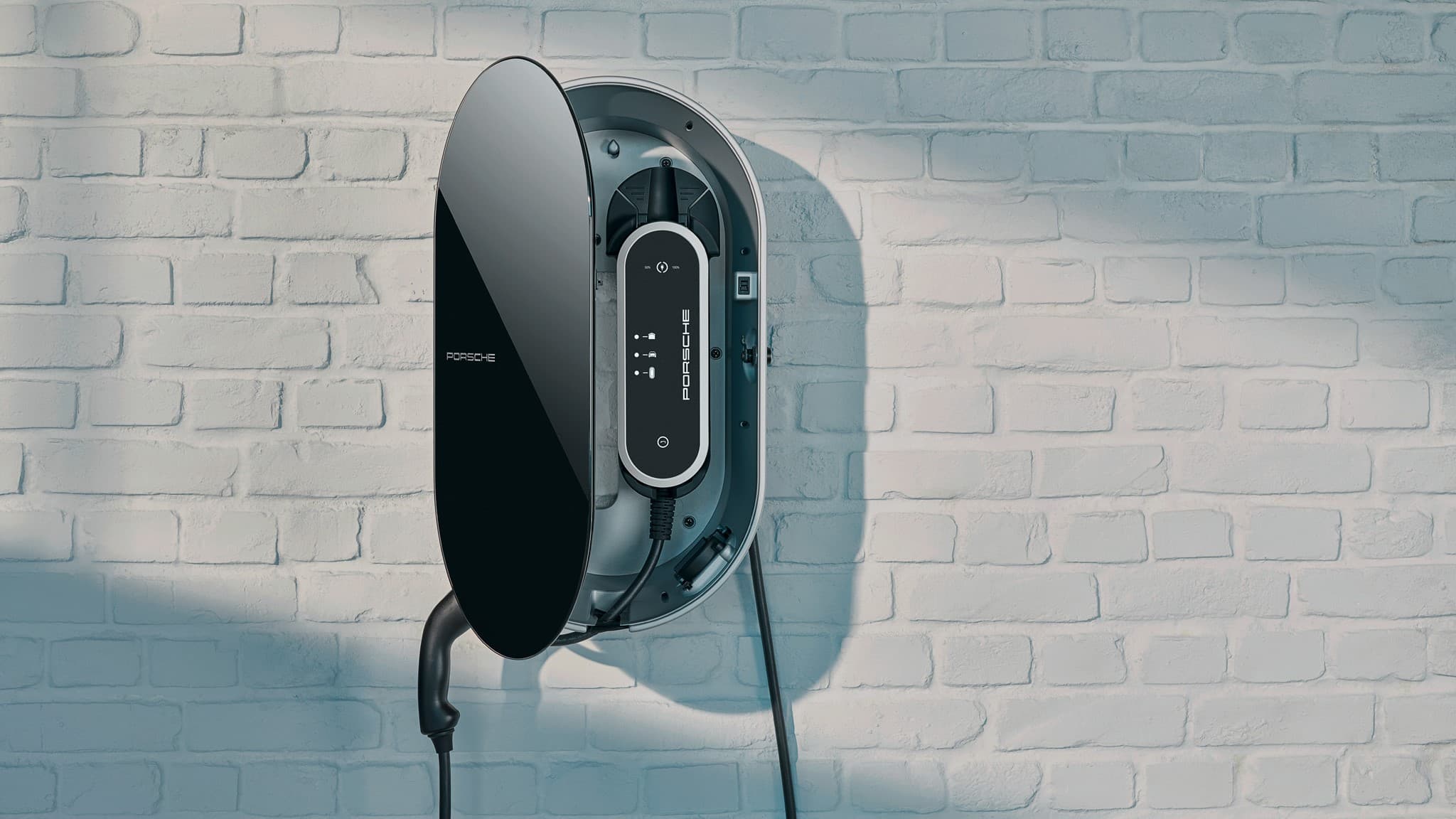 Porsche wall charger on white brick wall, sleek black design with visible cable, modern and minimalist aesthetic