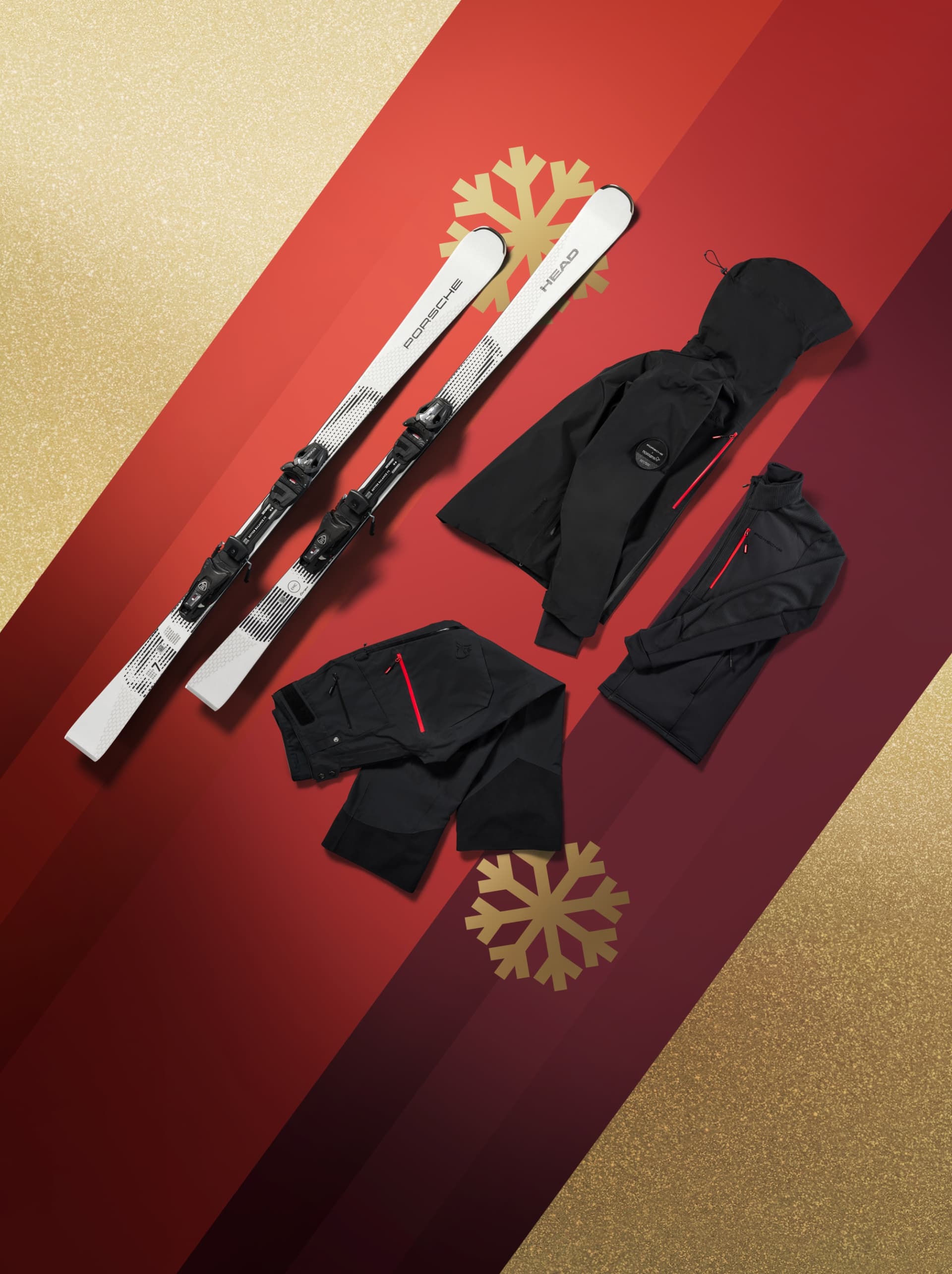 Winterjacke und Hose mit Ski auf rotem und goldenem Hintergrund.
