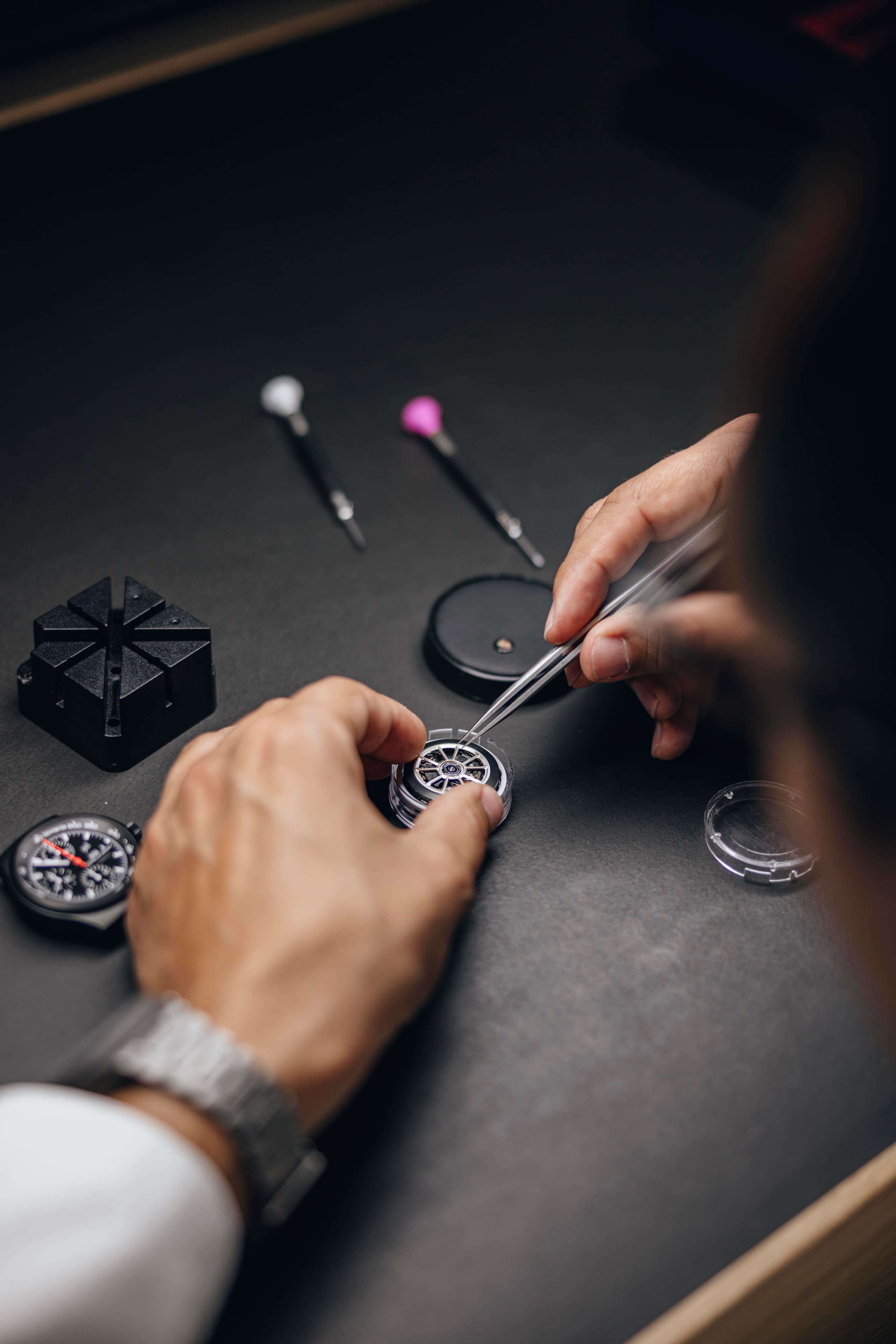 Watchmaker servicing a Porsche Design watch