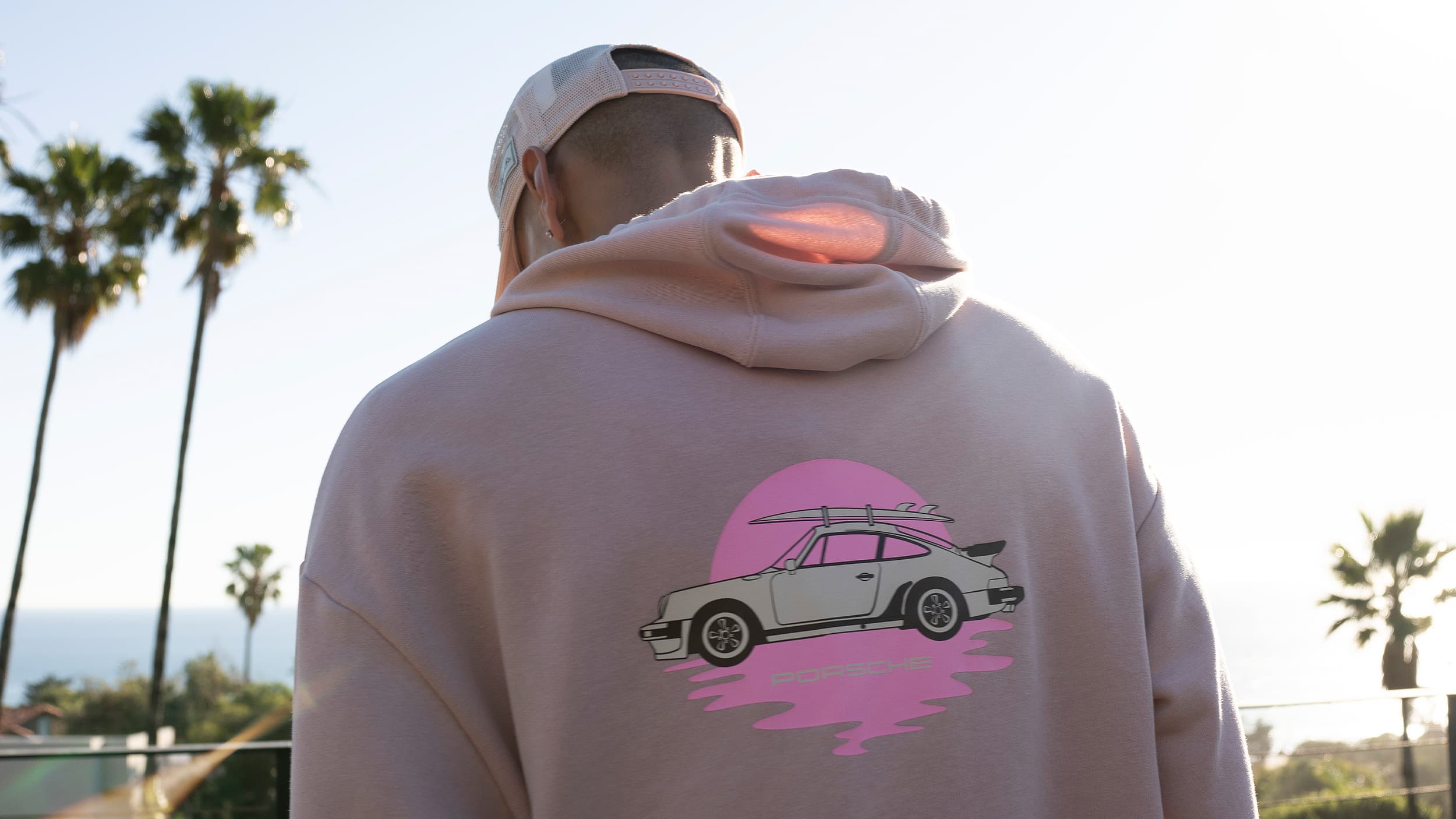 Open suitcase with new items from the Legacy x Pepita Porsche collection
