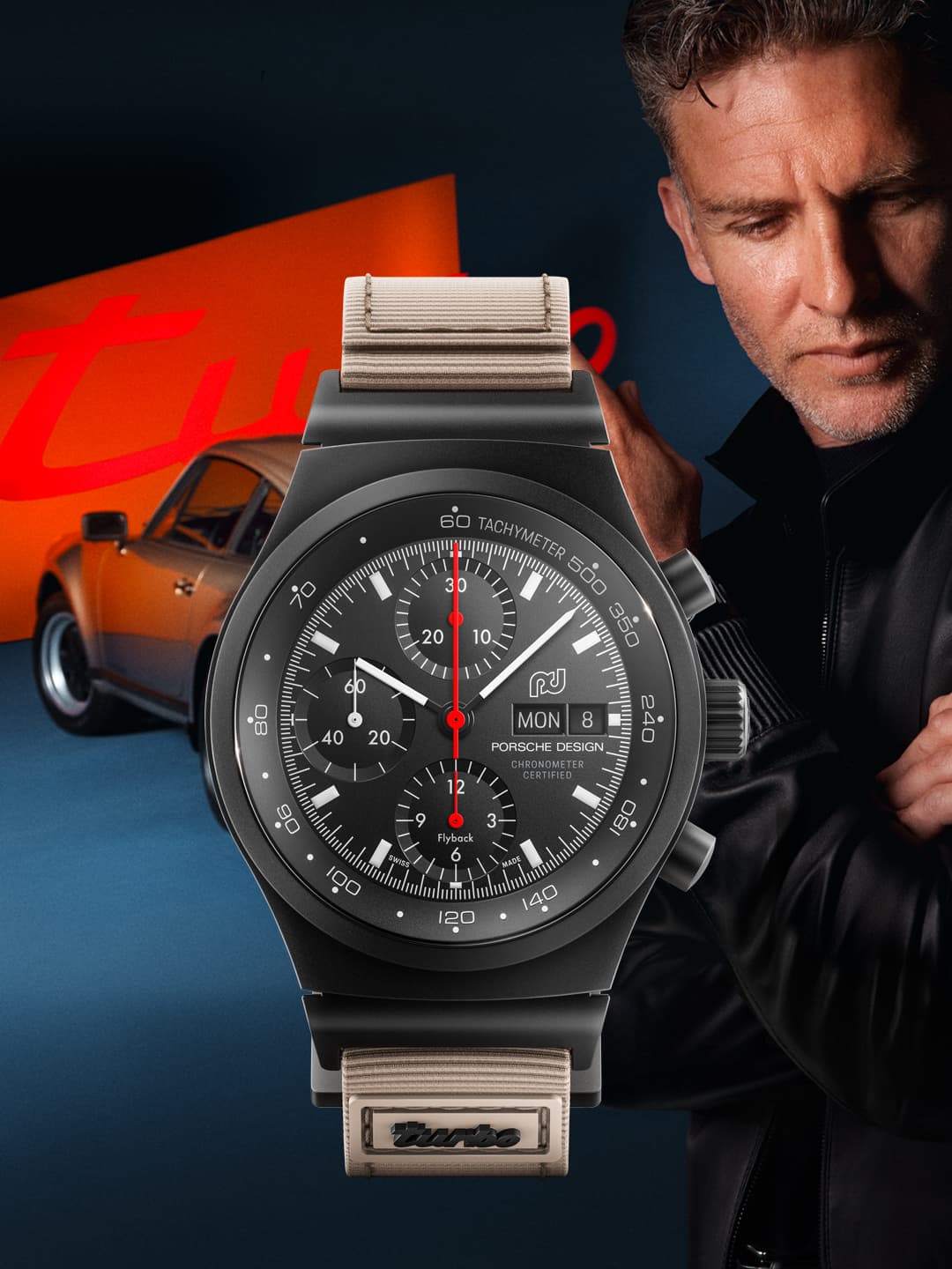Pictured is a wristwatch from Porsche, the Chronograph 1, with a vintage Porsche car and a man in the background