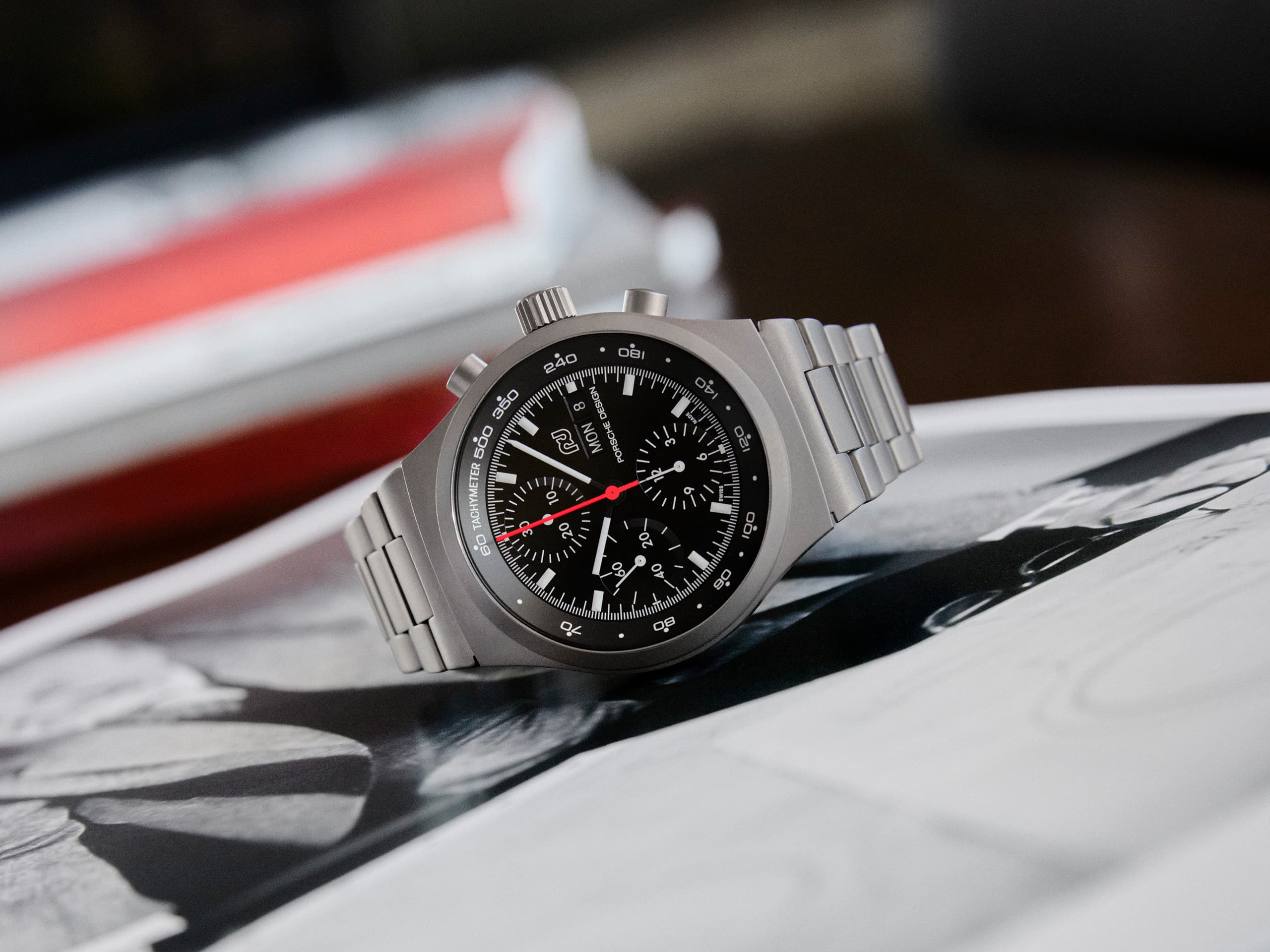 Chronograph 1 - 1975 Limited Edition on a open magazin showing an articla about professor F. A. Porsche