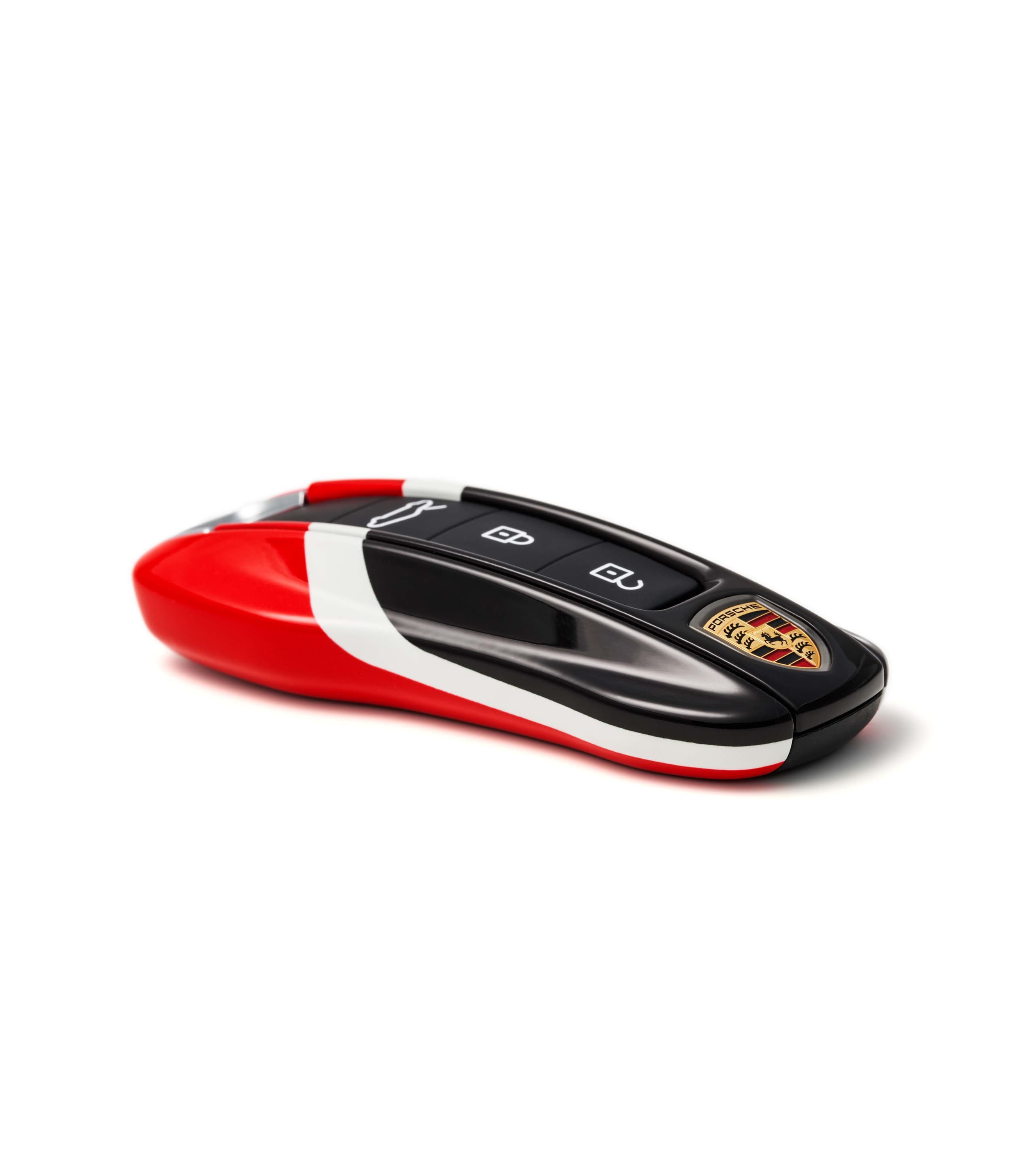 Red and black Porsche car key with logo, featuring white accents, placed on a plain white background.