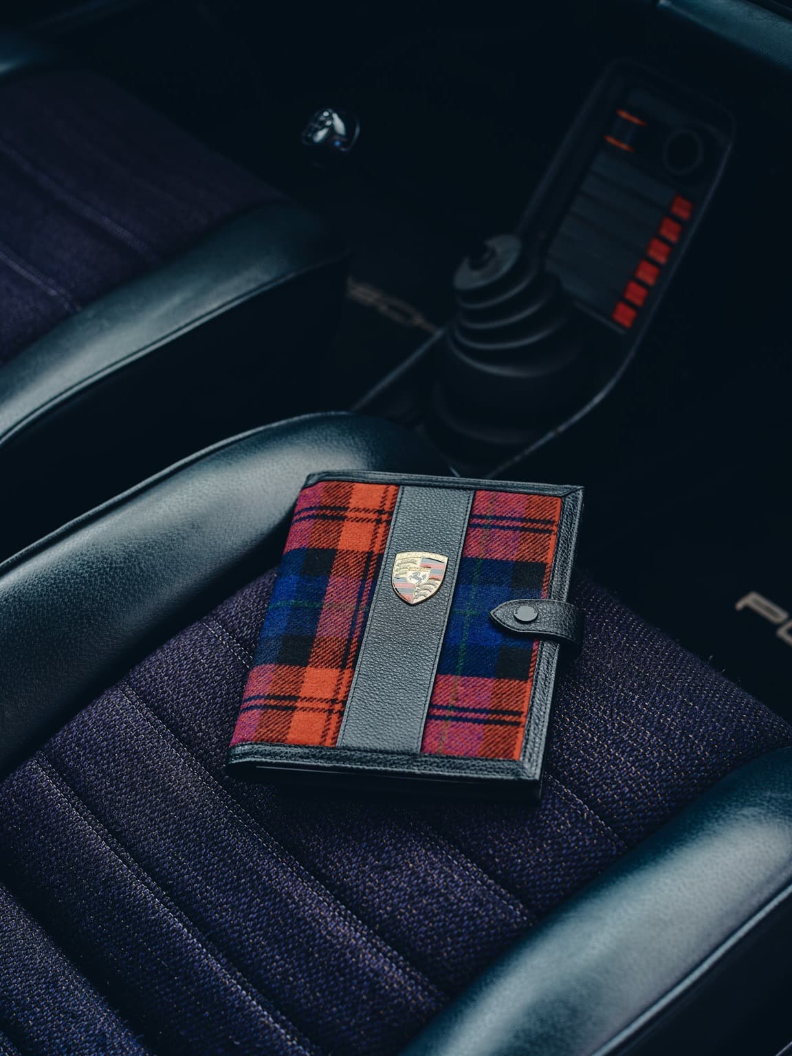 Porsche document folder lying on the seat in the car