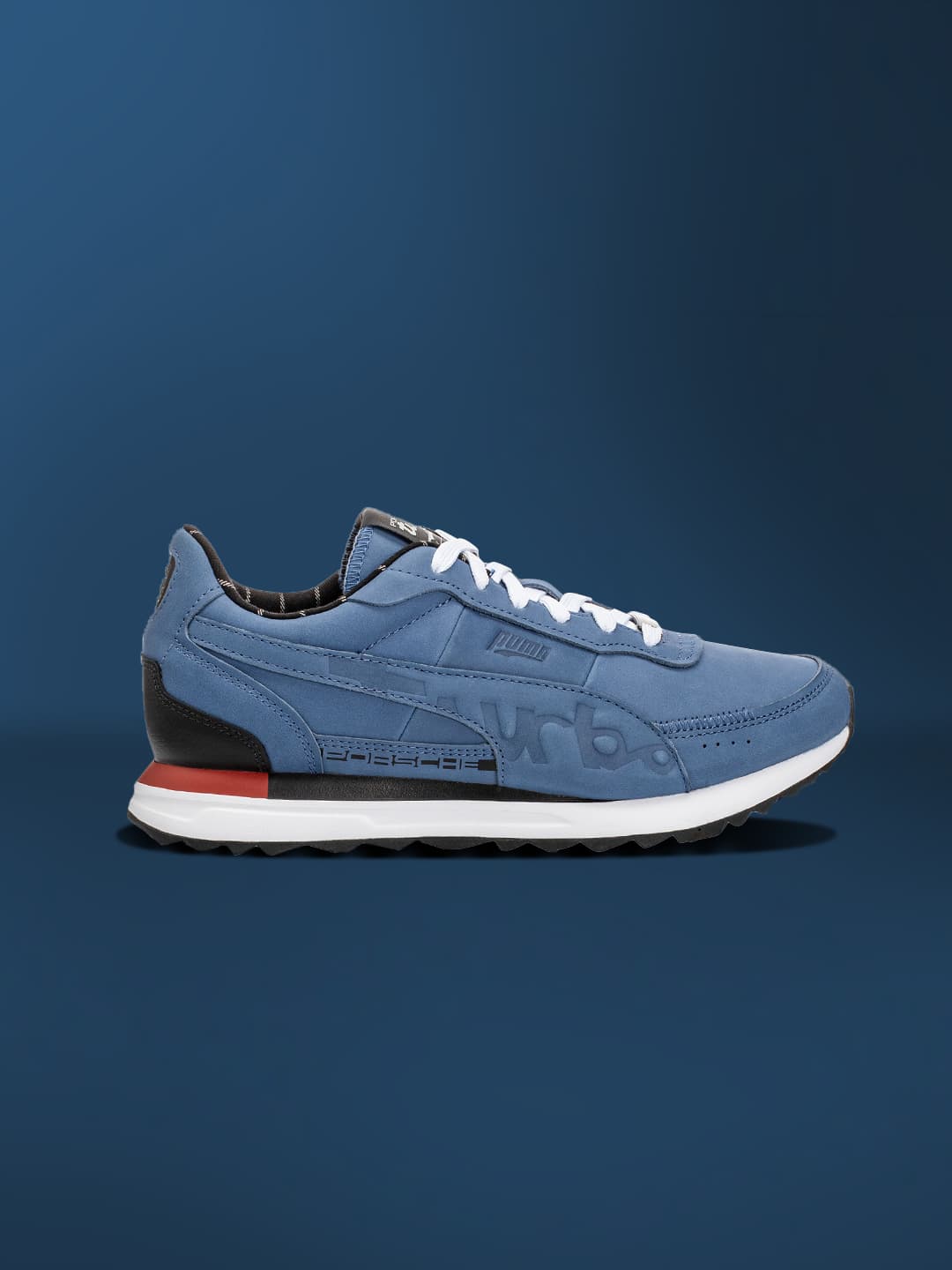 Dark blue colored sneaker on a dark blue background