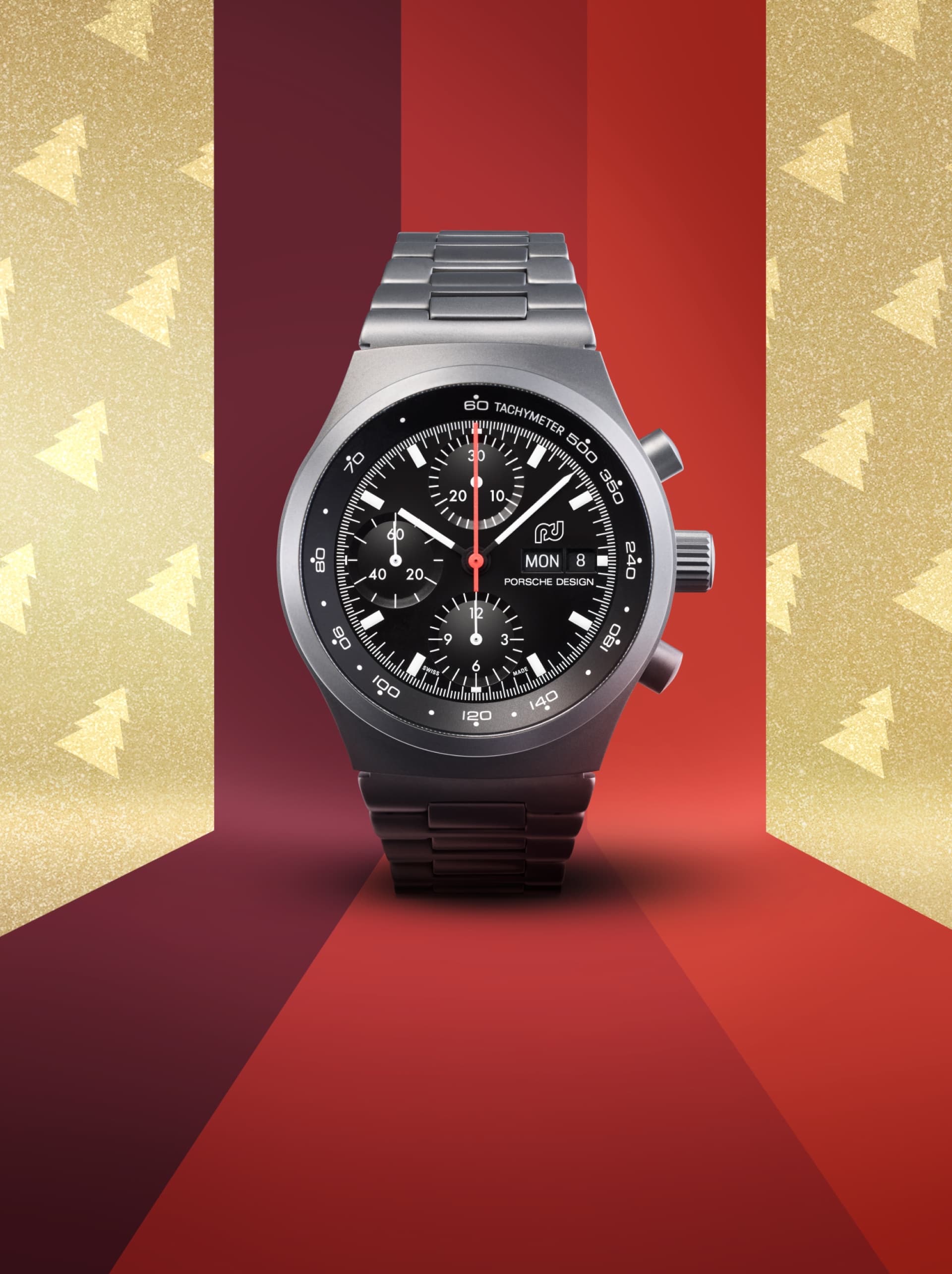 Relógio Porsche Timepieces preto sobre fundo vermelho e dourado com árvores de Natal douradas