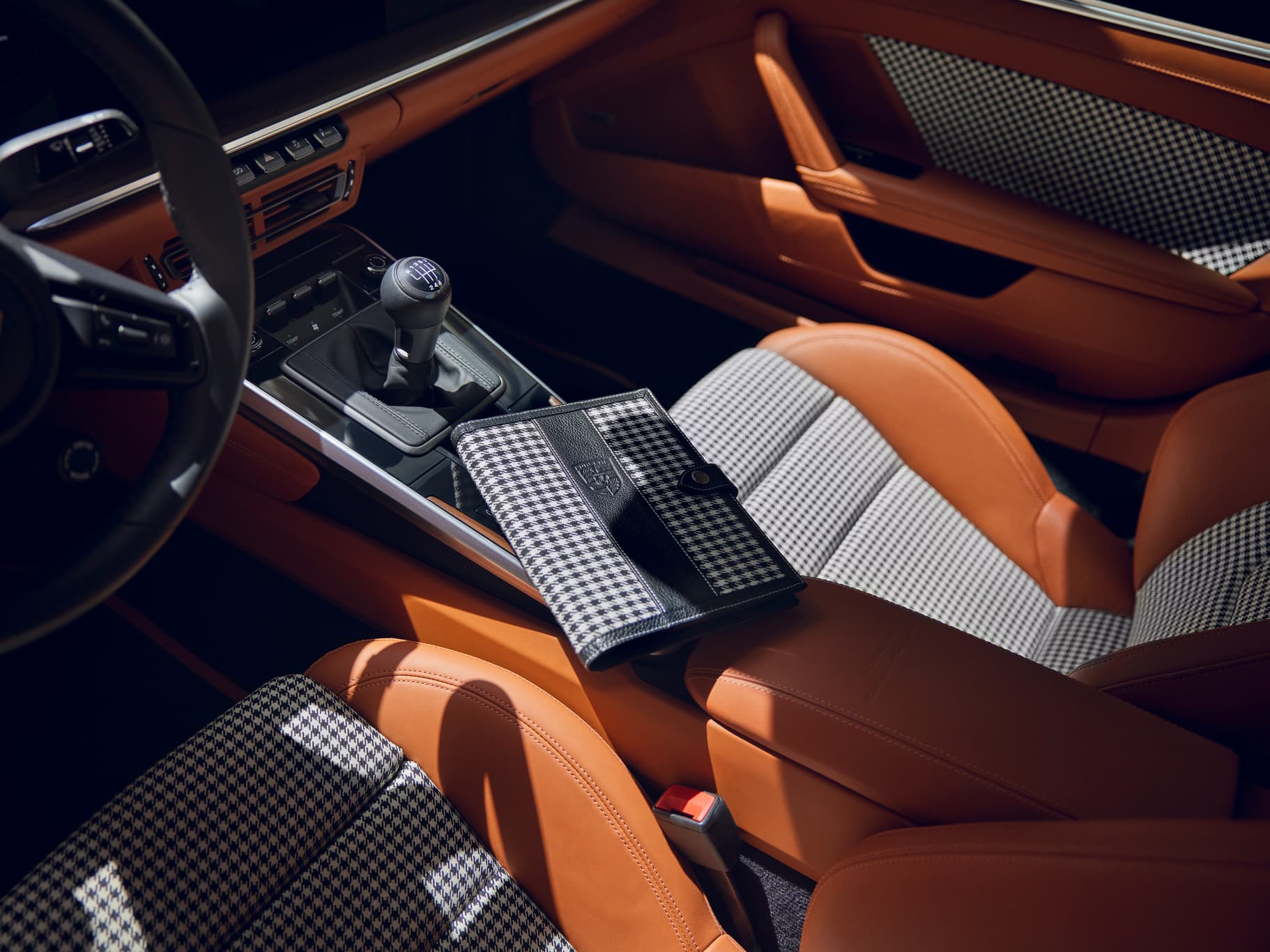 View into a Porsche classic car with seats with pepita pattern