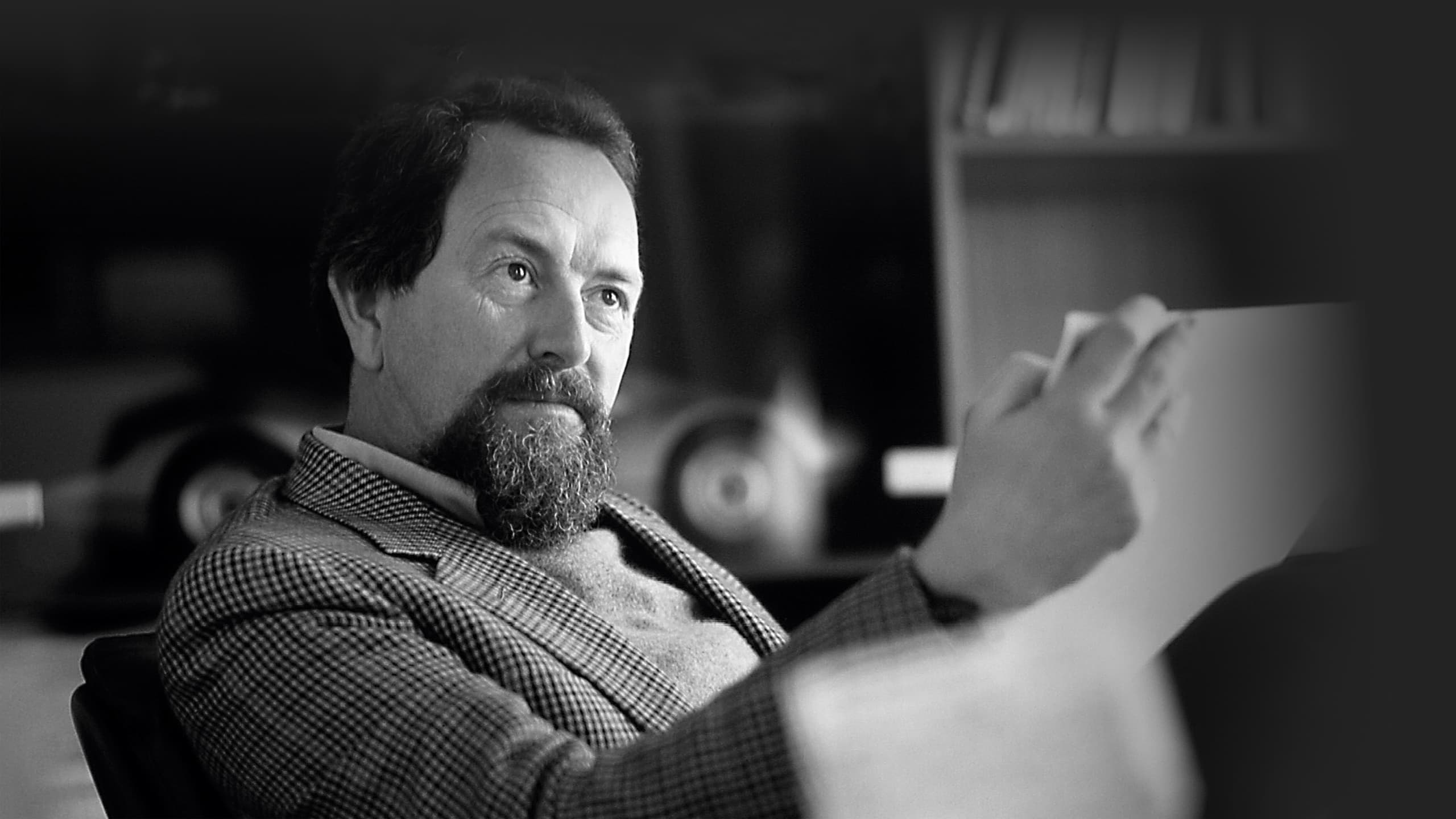 Picture shows Prof. Ferdinand Alexander Porsche sitting in a chair, holding a scibble in his hand