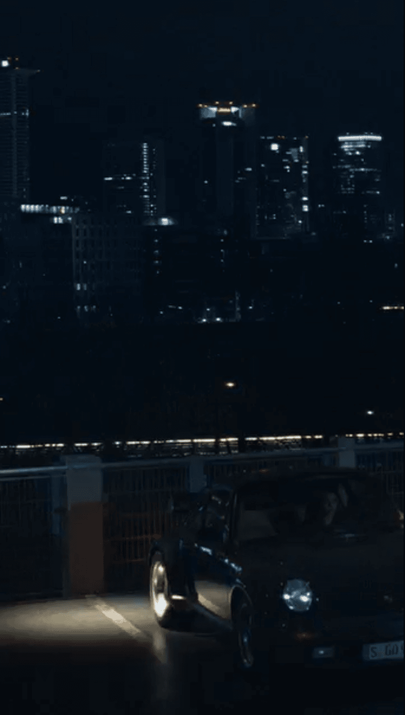 Porsche Classic car on a parking roof by night