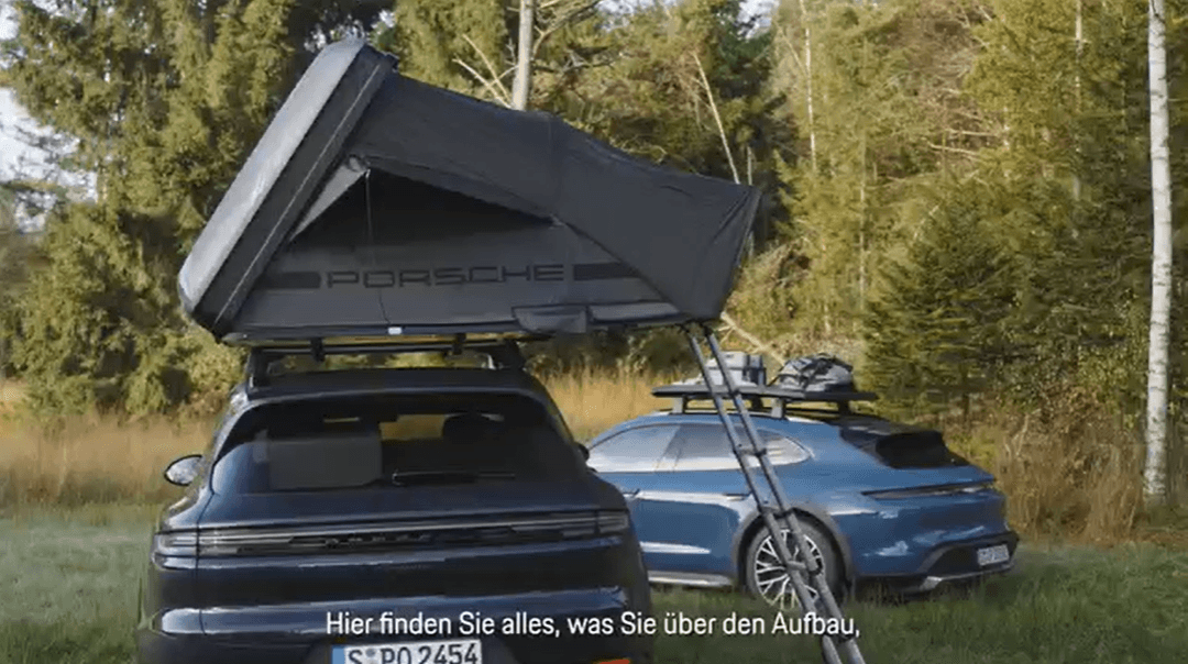 two Porsche cars next to each other in the forest with Porsche roof tent