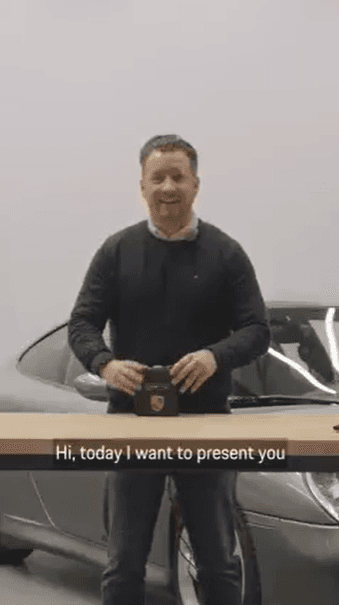 Man stands at a table and explains the product on it