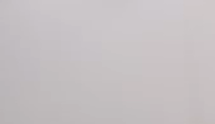 Man stands at a table and explains the product on it